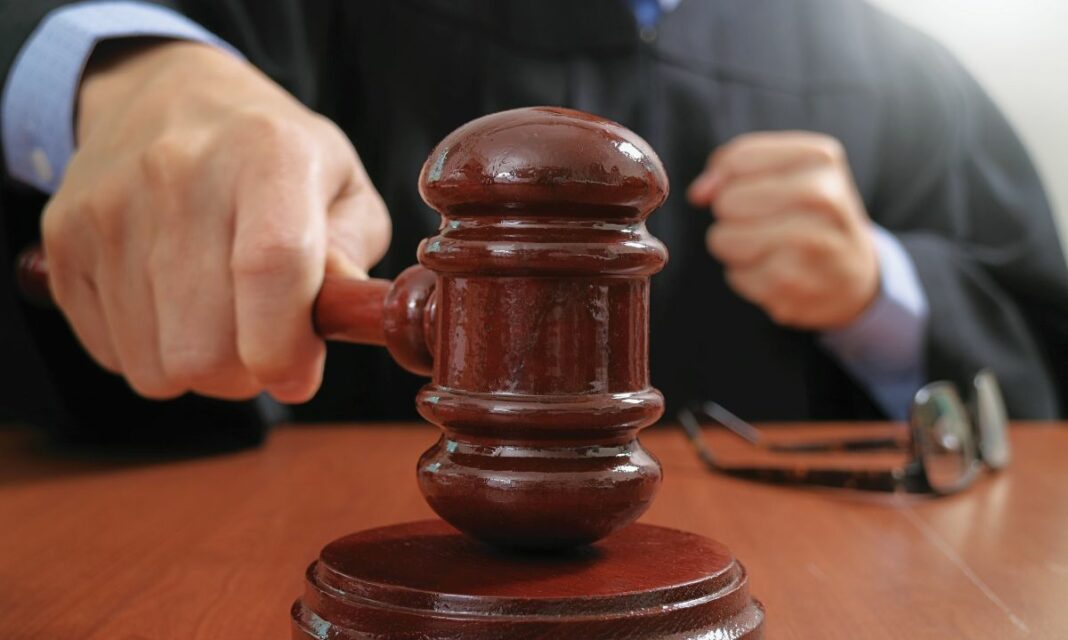 Justice,And,Law,Concept.male,Judge,In,A,Courtroom,Striking,The shutterstock 564012475
